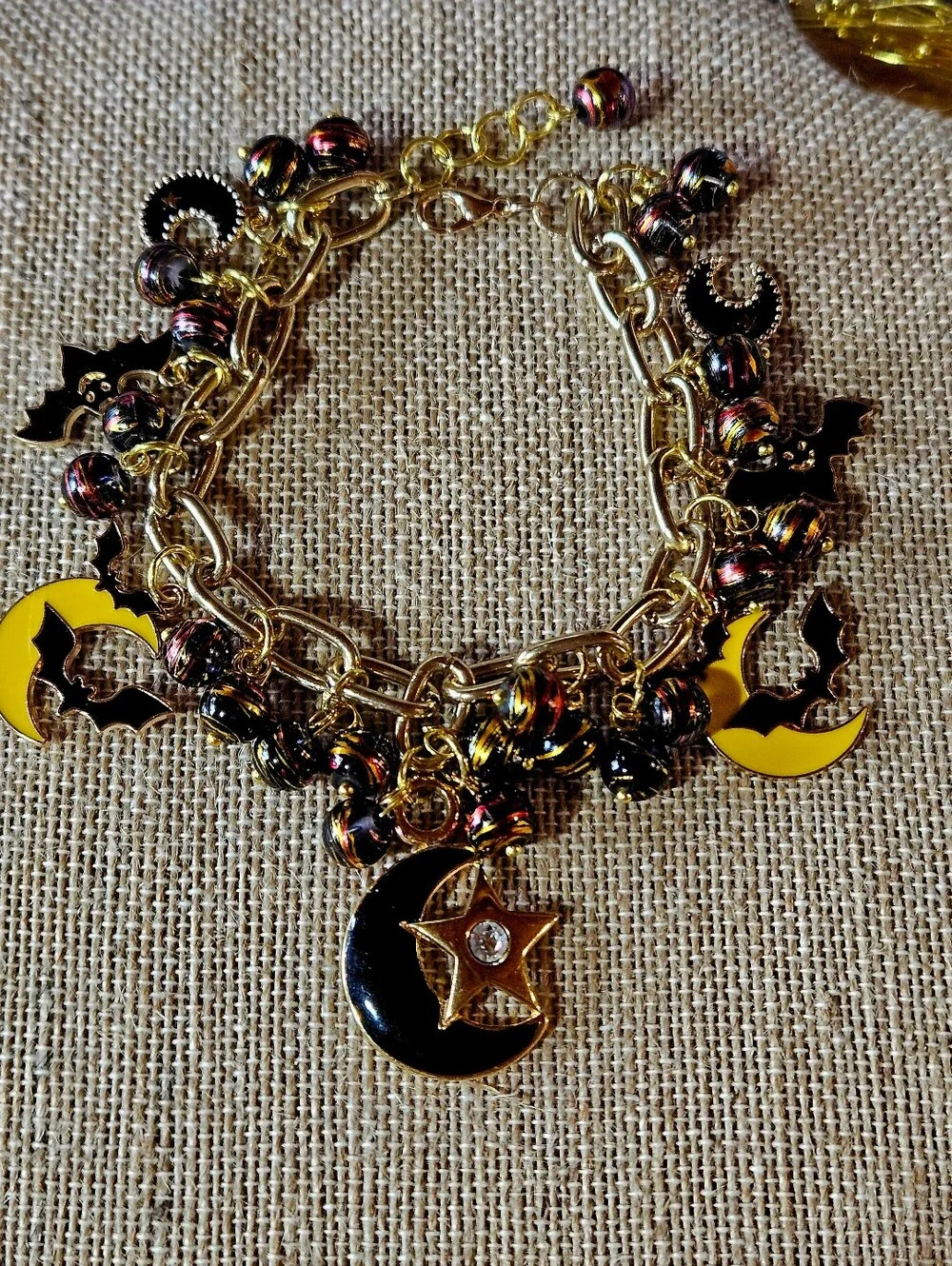Gold-Tone Moon, Stars And Black Bats Charm Bracelet in Black and Yellow - Picture 2 of 8